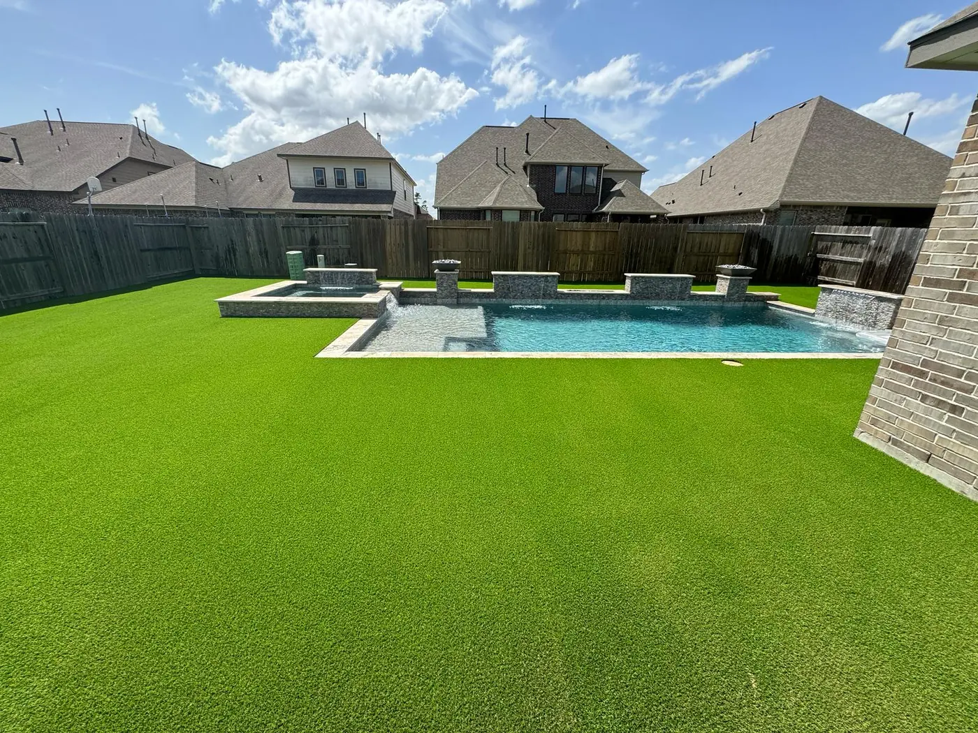Houston Turf Installation around a pool.