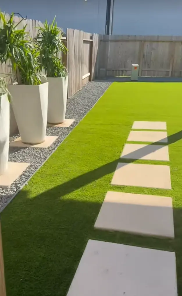 Side walkway backyard artificial turf installation houston turf